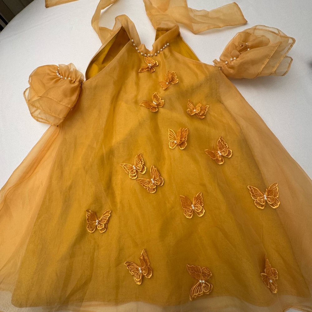 Elegant Gold Dress with Butterfly Accents
